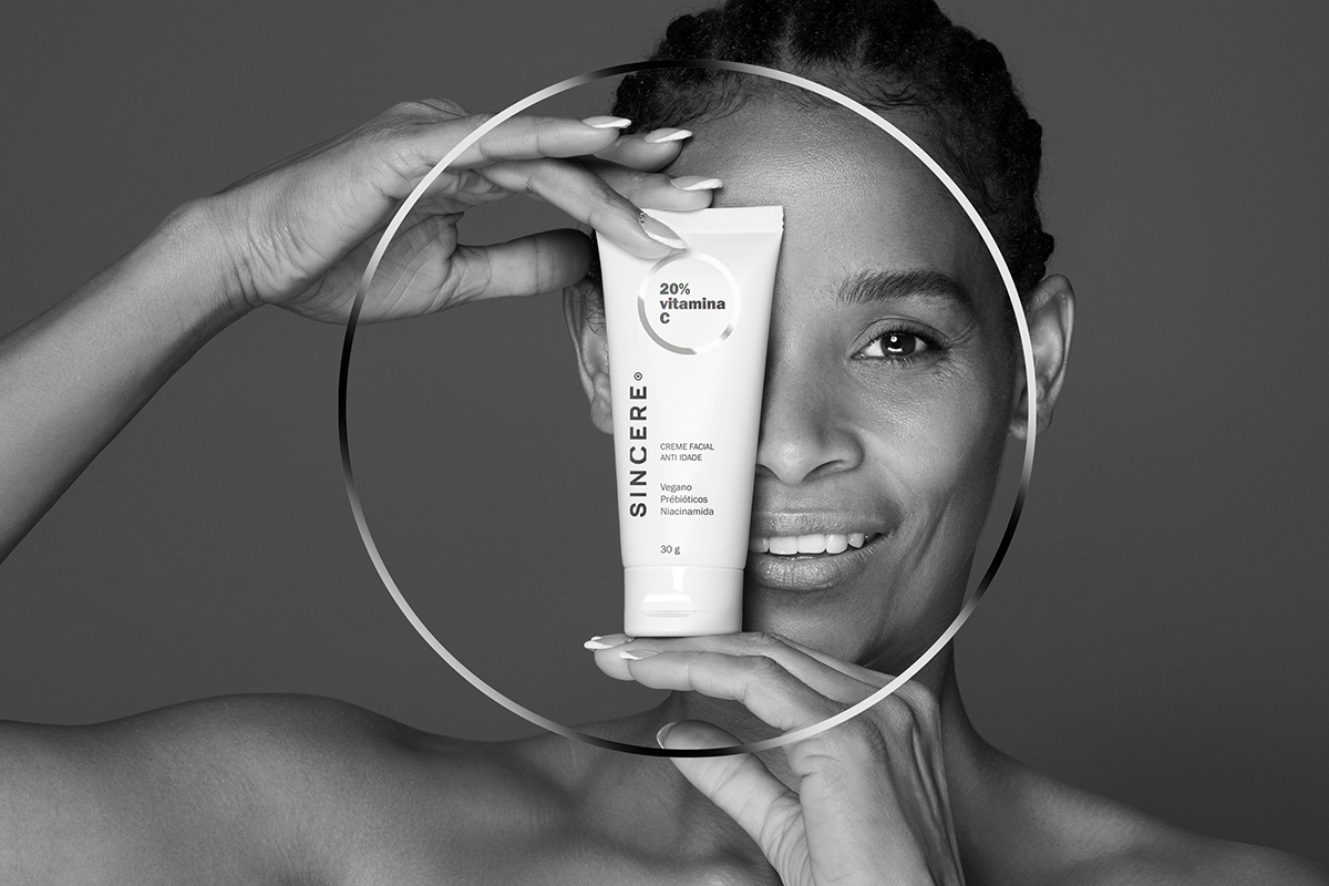 Naming, Branding and Packaging design for SINCERE products using a black and white palette. A silver circle 'lens' highlights the product benefits, with color codes for Hair (Lilac) and Sun (Gold).